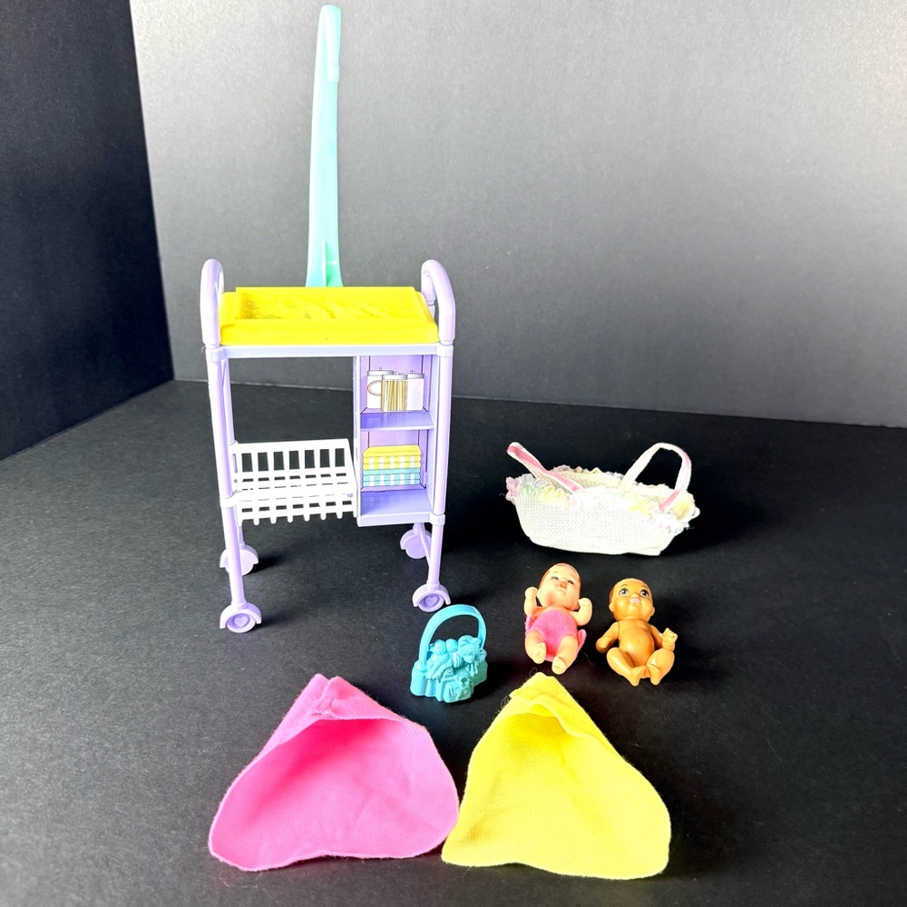 Lot Of 2 Mattel Barbie Babies, Moses Basket, 2 Blankets, Baby Table & Toy Bag
